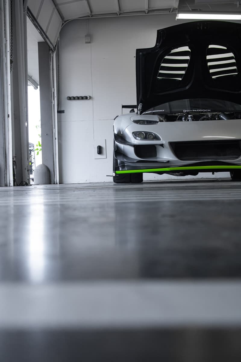 Coated gray garage floor with a parked sports car