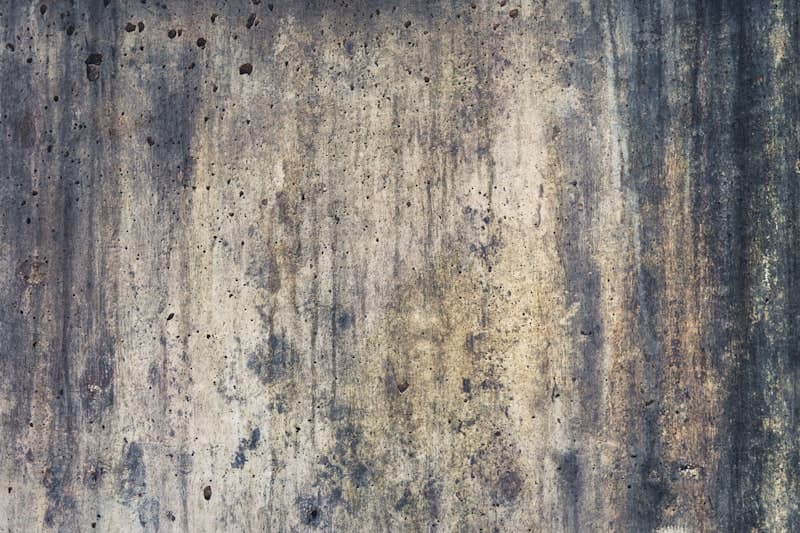 Worn concrete surface with stains and visible wear